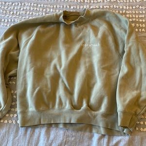 Essentials fear of god light green crewneck in a size medium